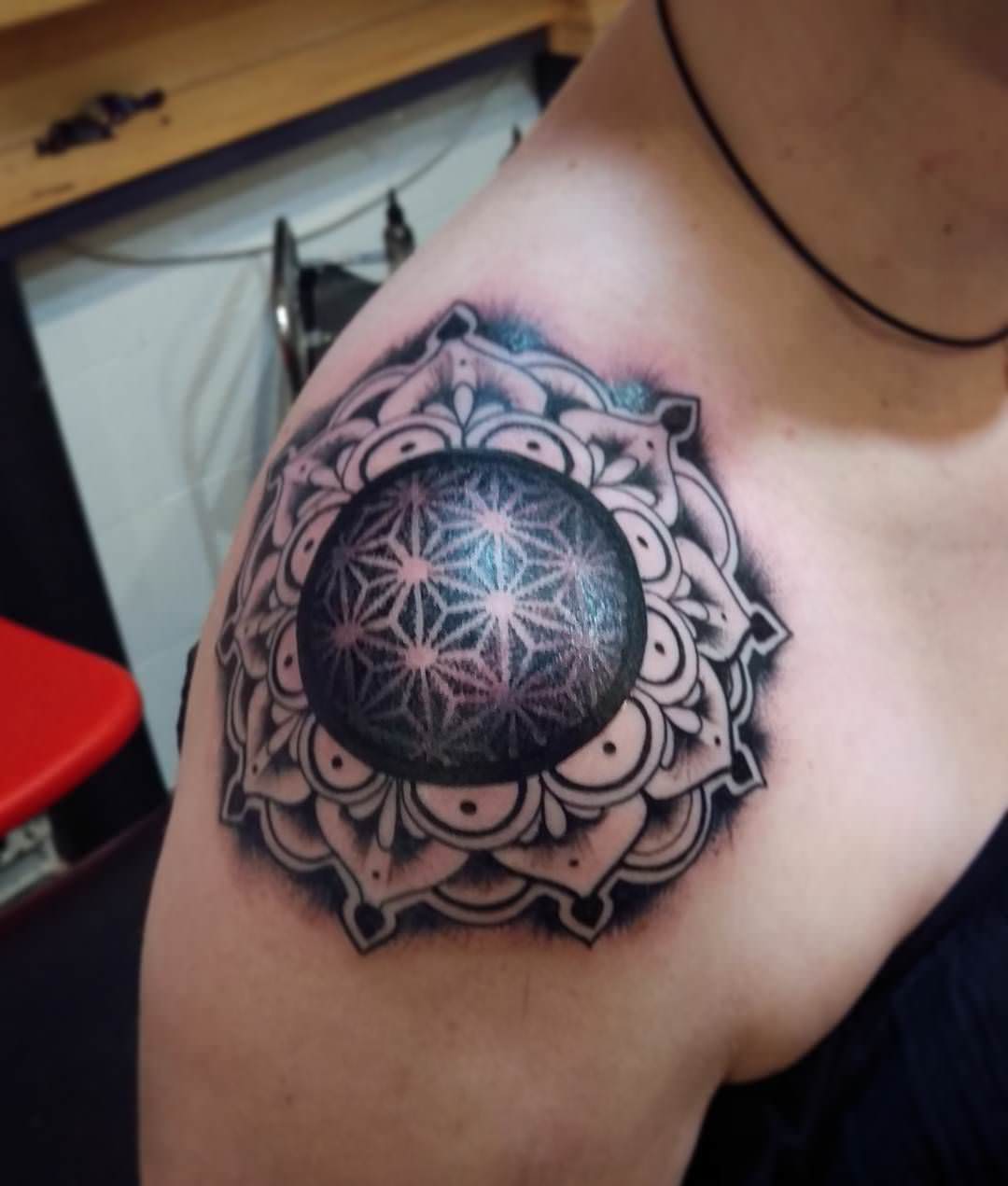 ink mandala tattoo design on shoulder