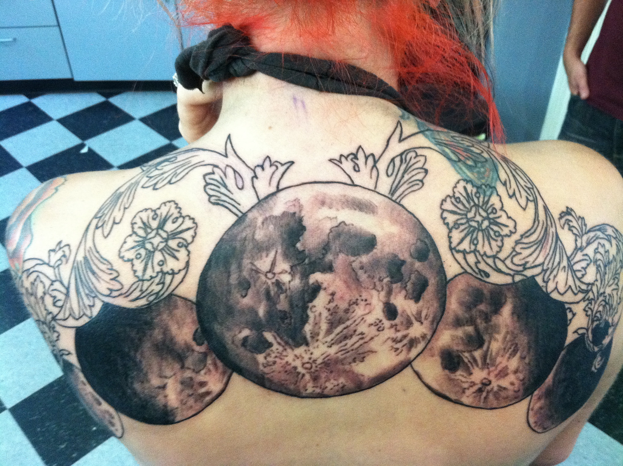 mandala pattern tattoo on back