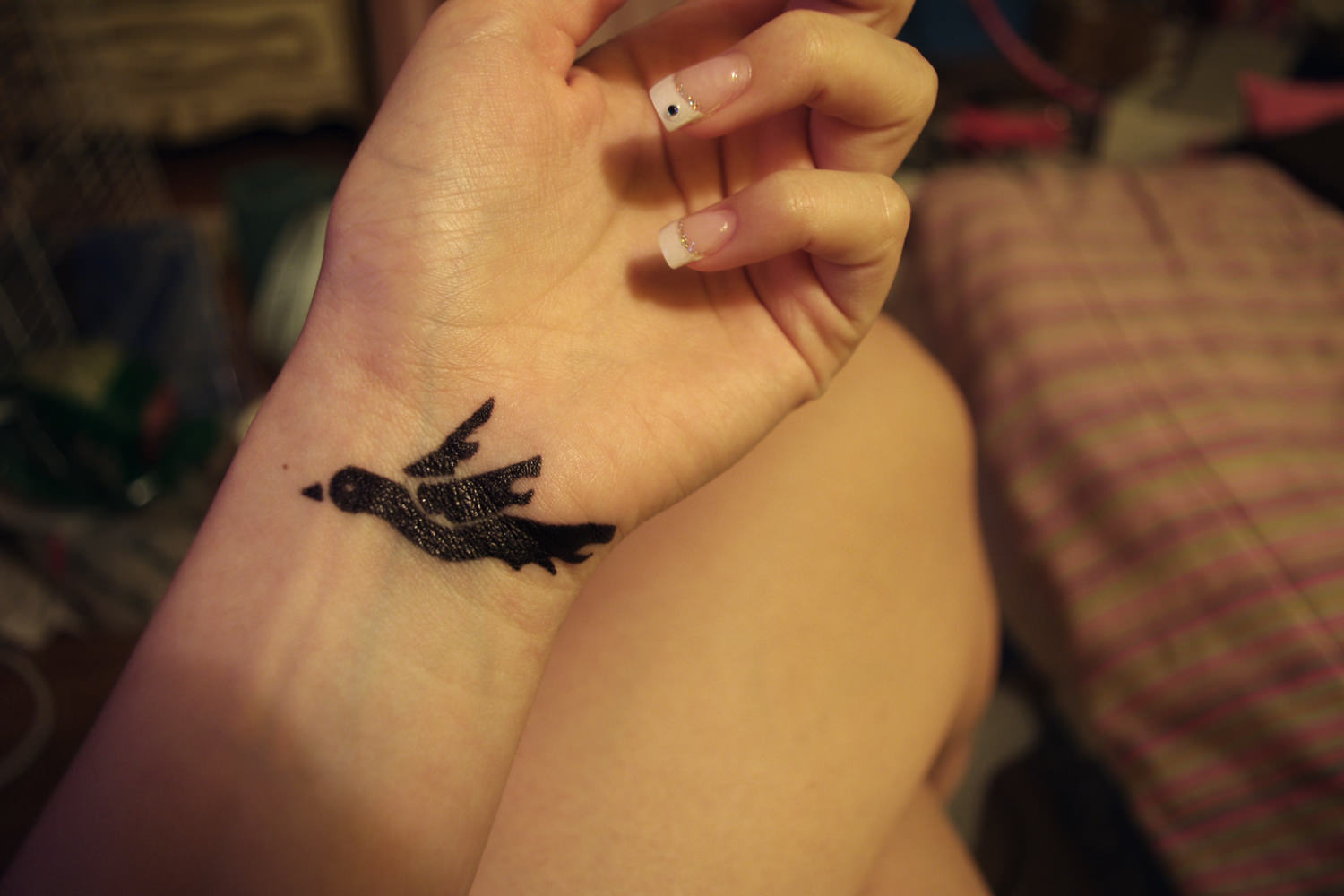 acrylic dove tattoo on wrist