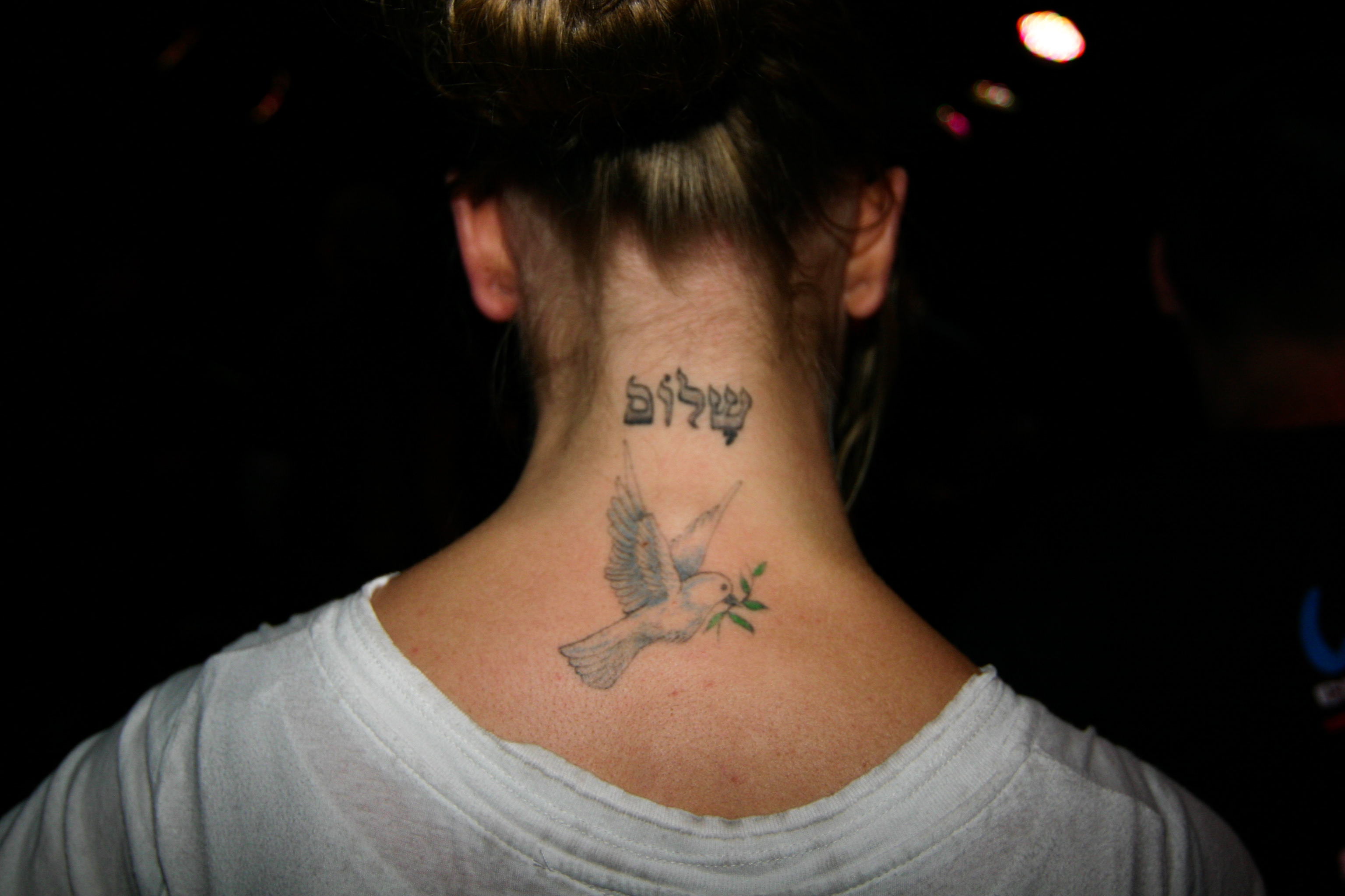 dove neck tattoo