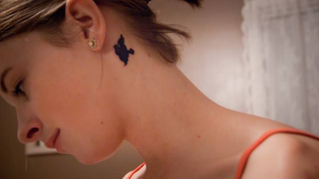 dove tattoo behind the ear