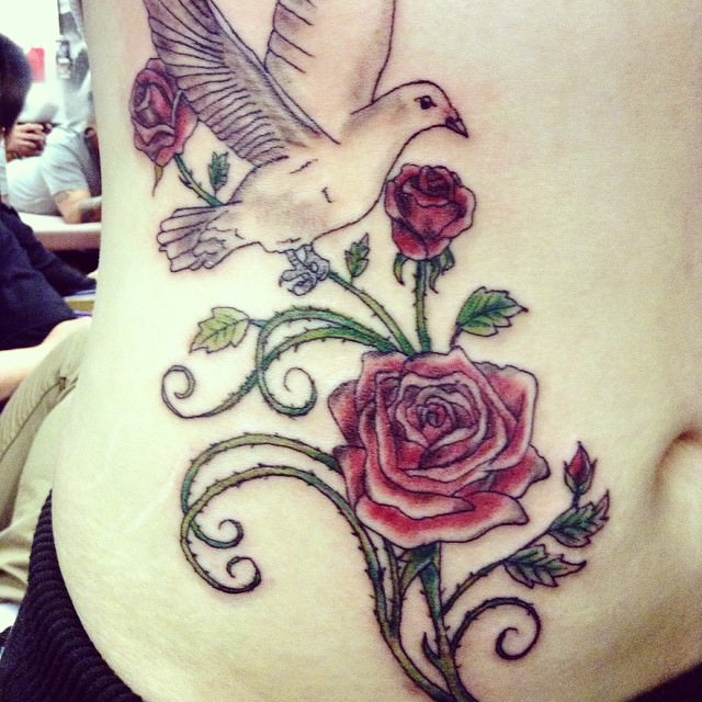 dove tattoo with rose design