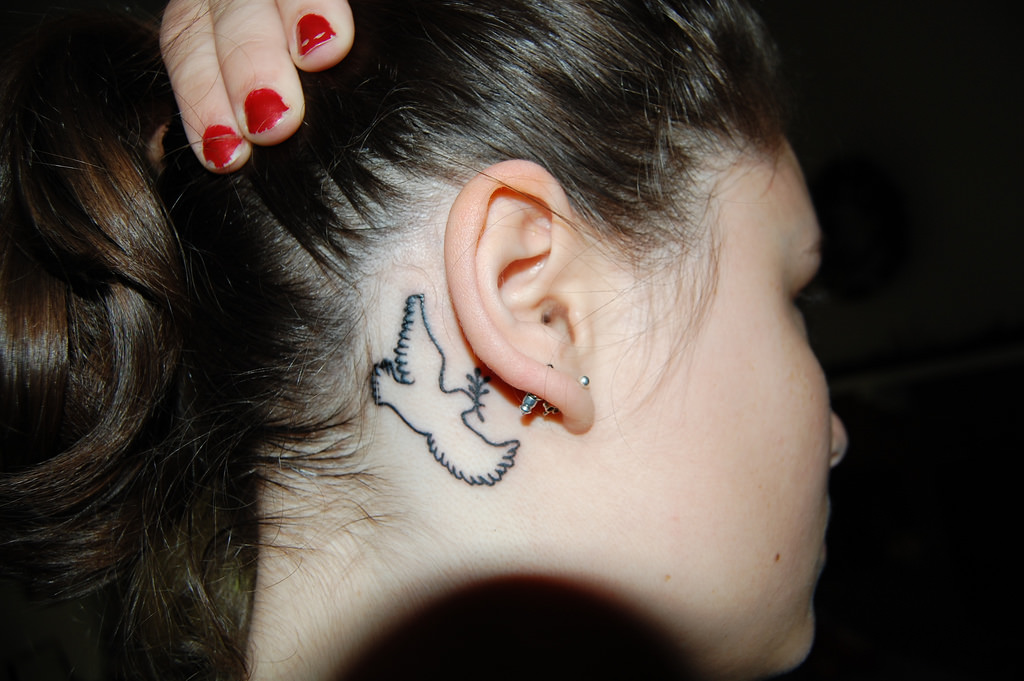 dove and olive branch tattoo on ear back