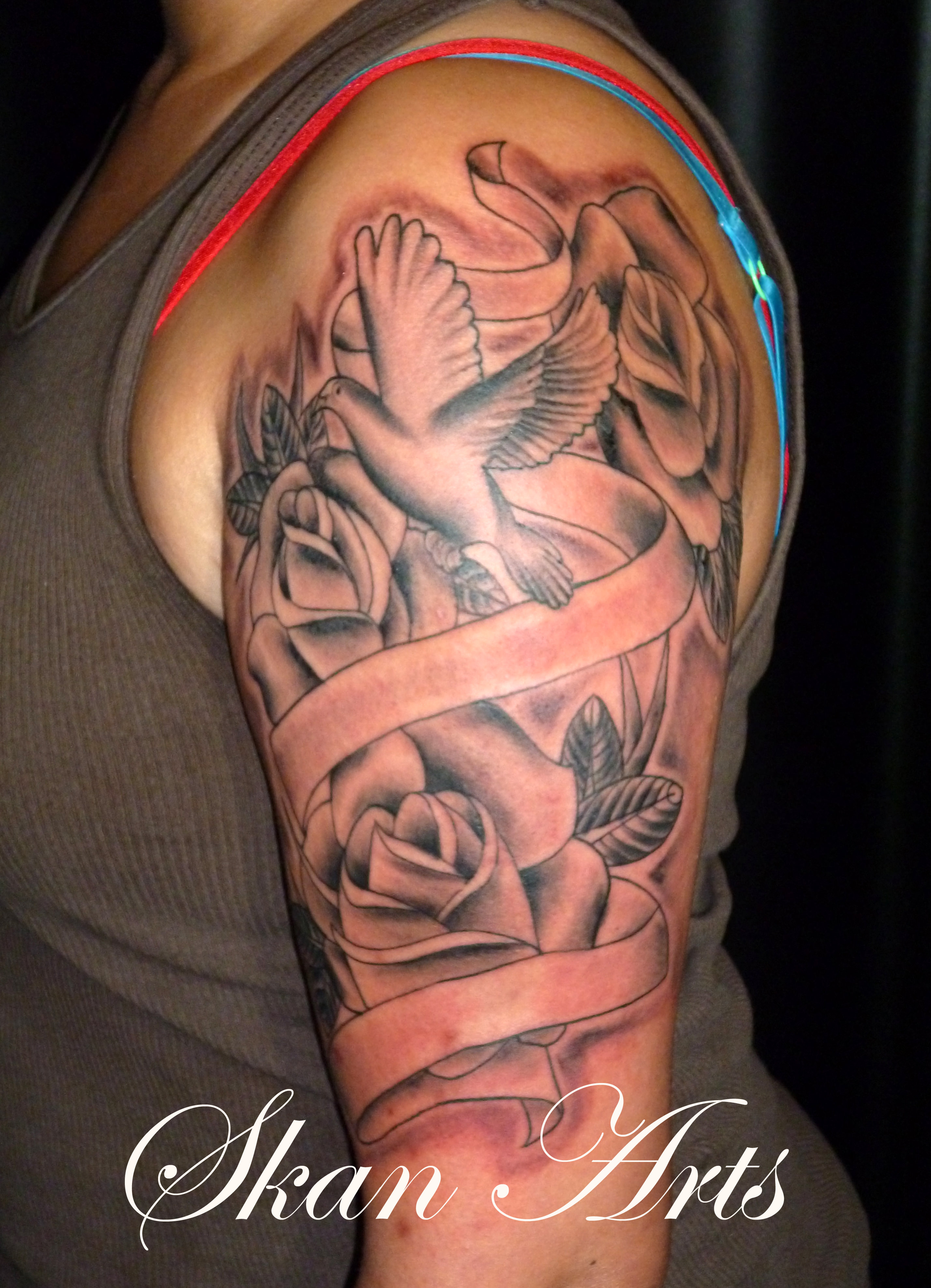 dove and rose tattoo on sleeve