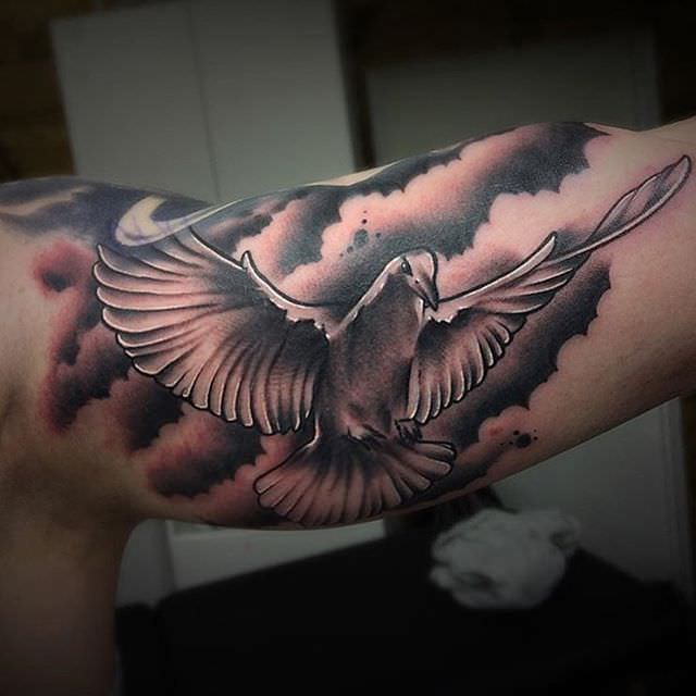 flying dove tattoo on sleeve