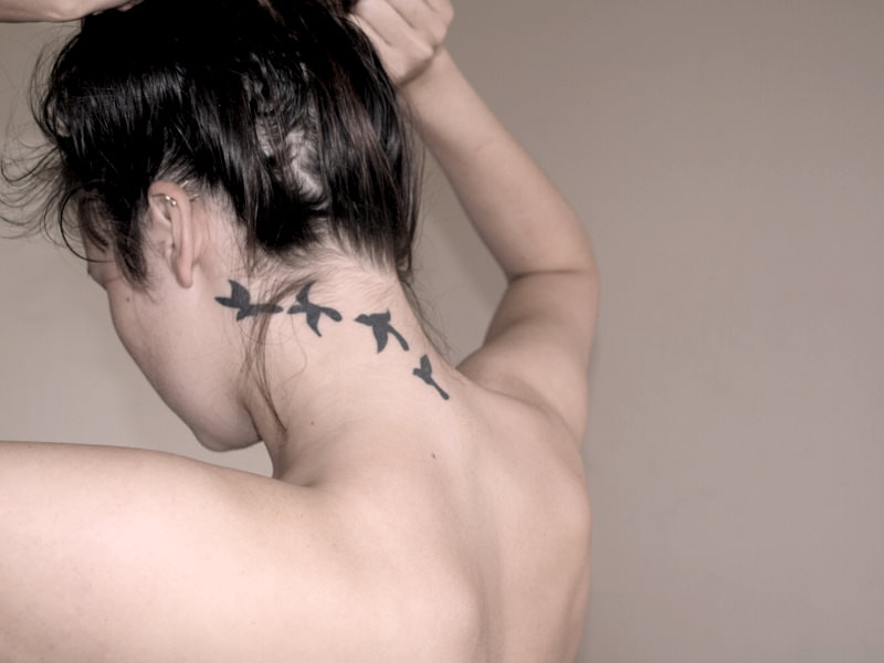 small dove tattoos on neck
