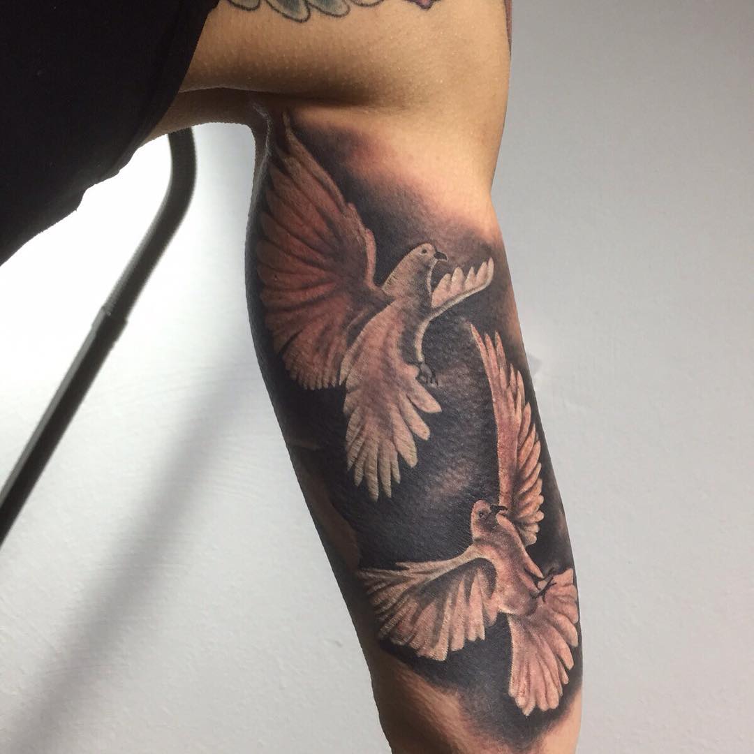 white dove tattoo on legs