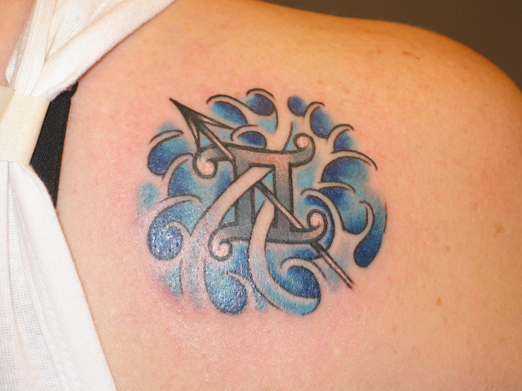 gemini tattoo design with arrow