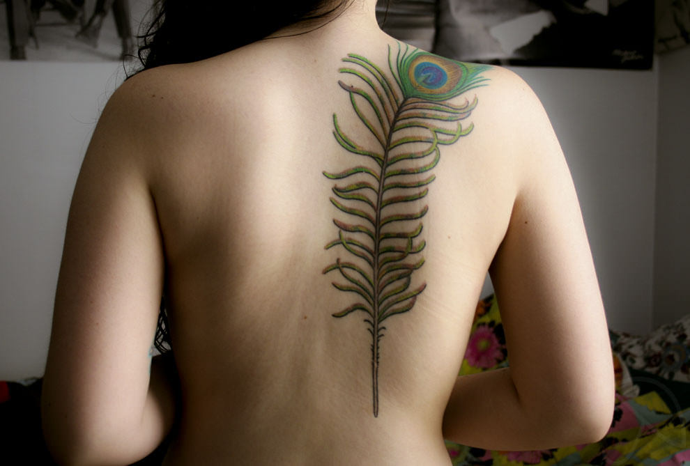 upper back feather tattoo