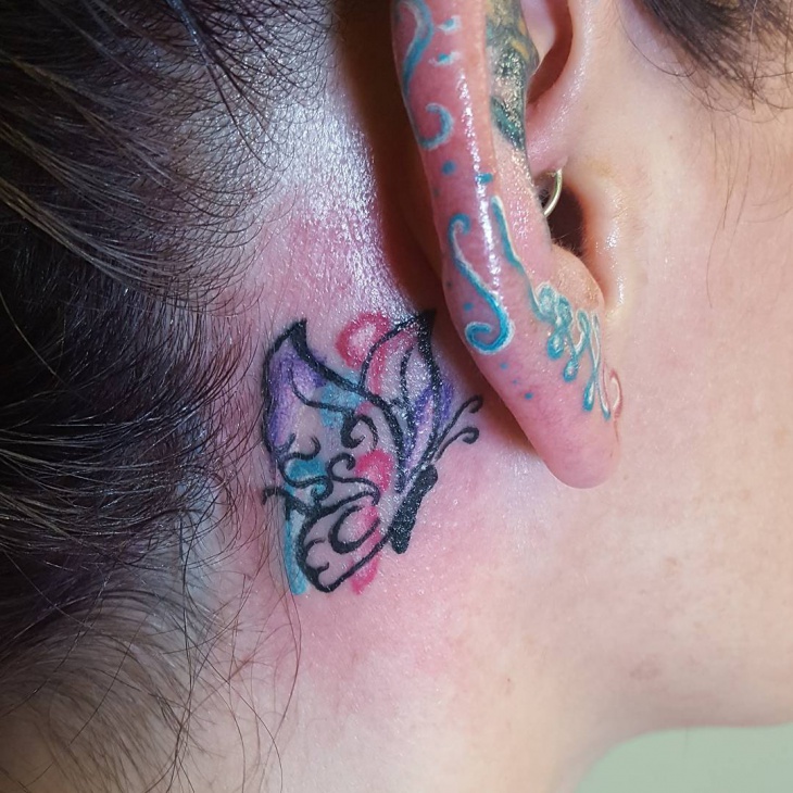 butterfly tattoo on behand ear