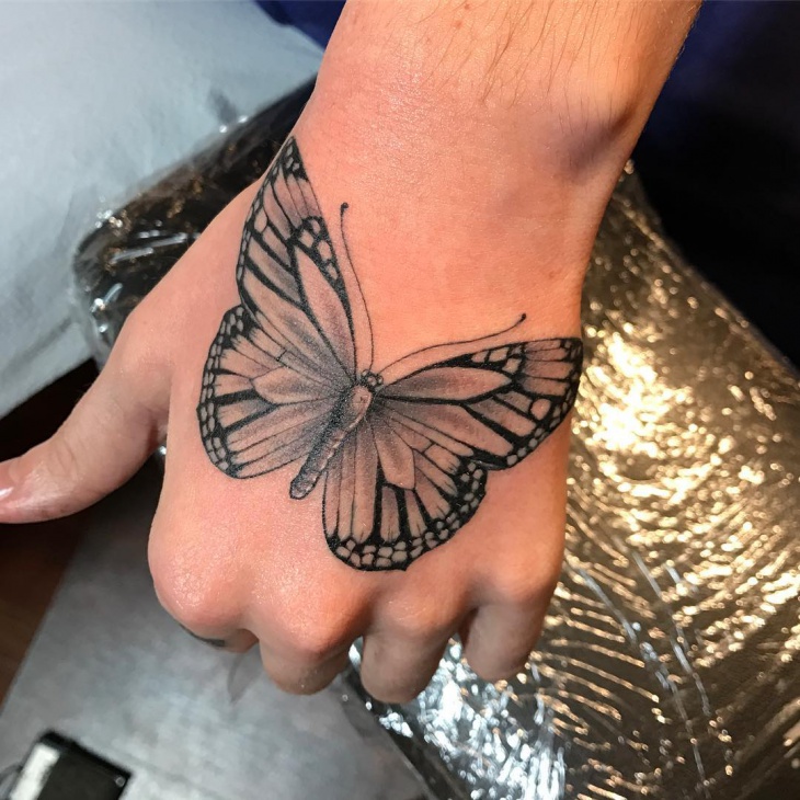butterfly tattoo on palm