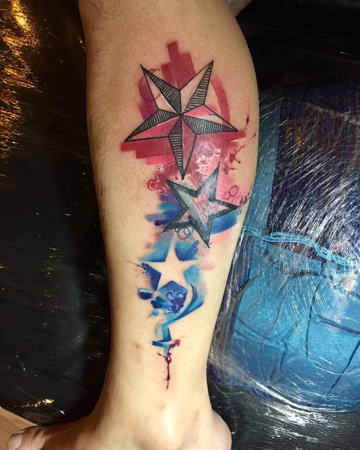 water color star tattoo on leg