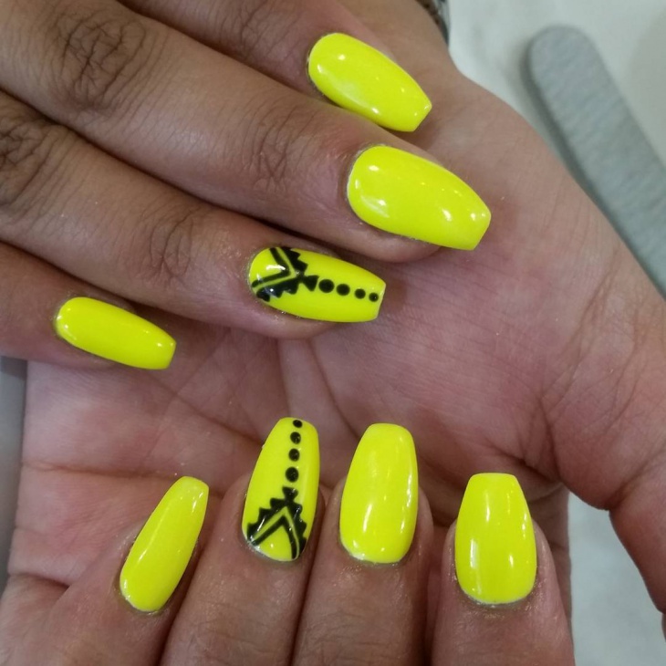 yellow and black nail design