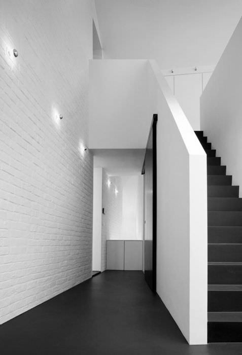 white brick wall corridor