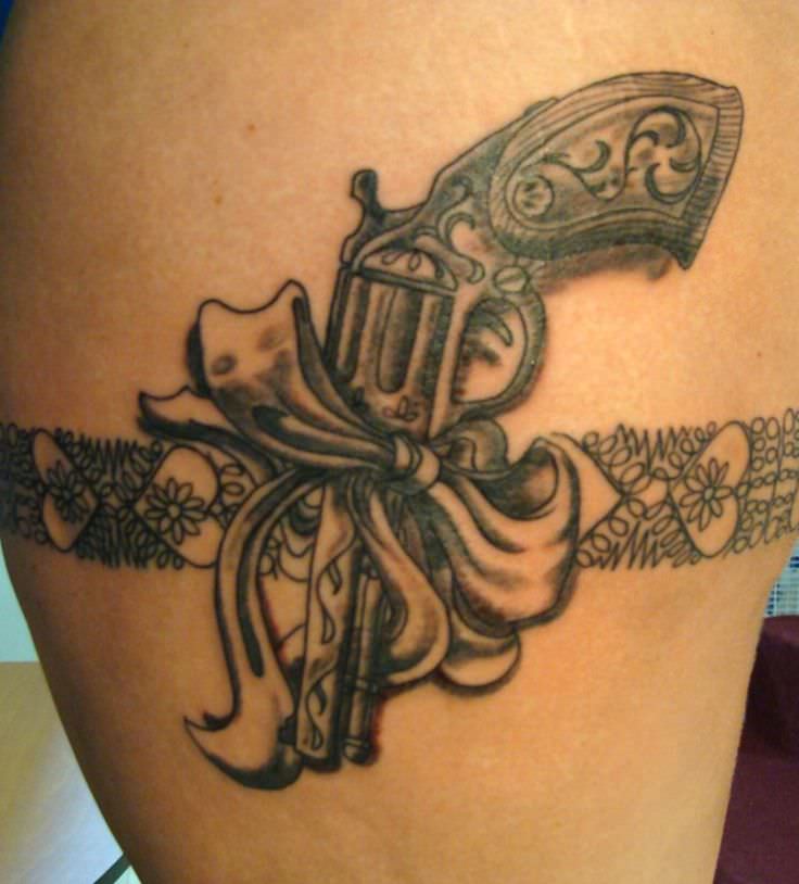 love the ribbon gun tattoo designs