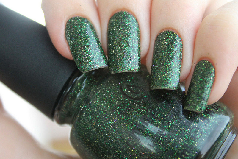 green nail design with glitter