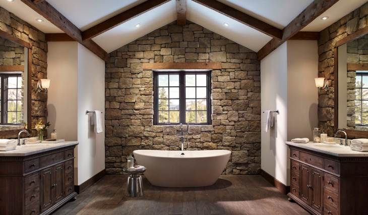 rustic bathroom with stone wall