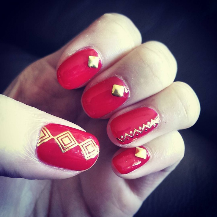 flashy red and gold nail design