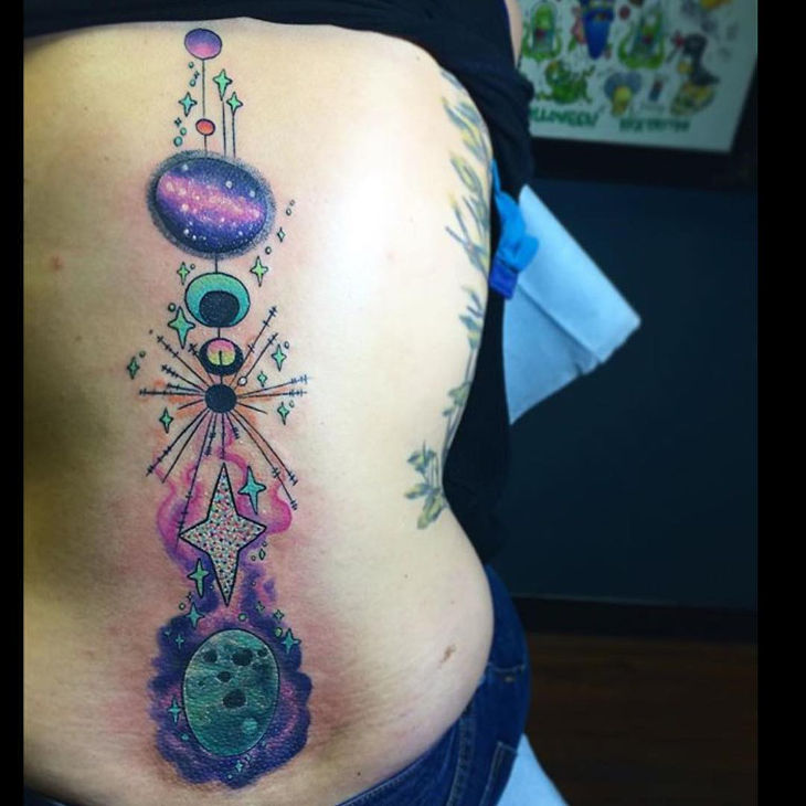 fake galaxy spine tattoo