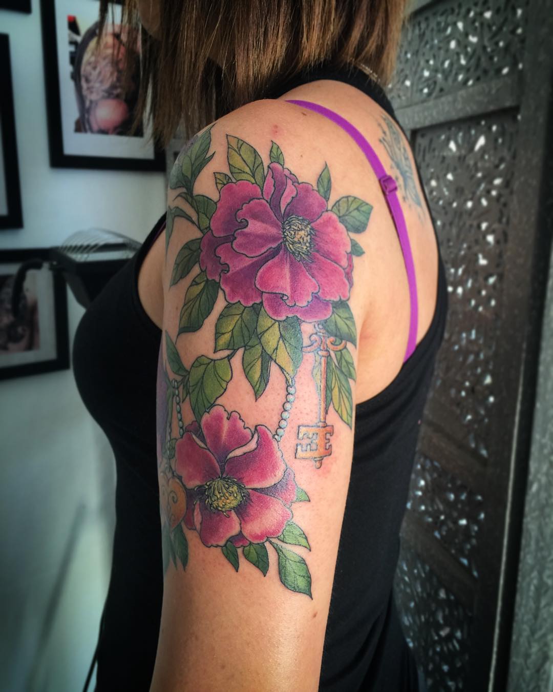 pink flower sleeve tattoo