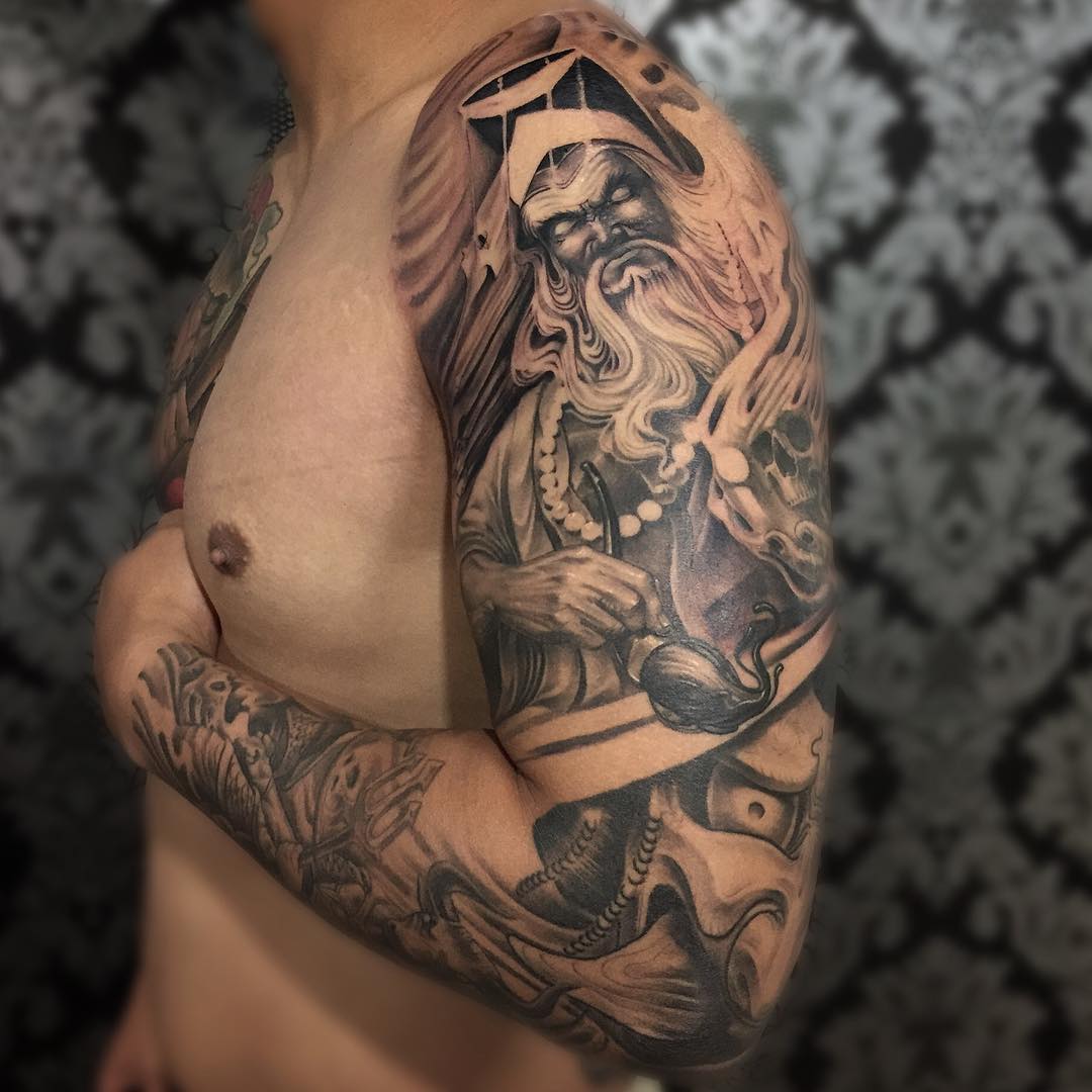 artist arm sleeve tattoo design on left hand
