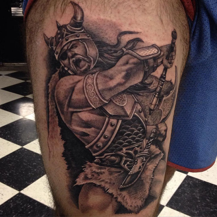 fearful viking tattoo on leg