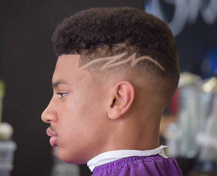 fade haircut with a part