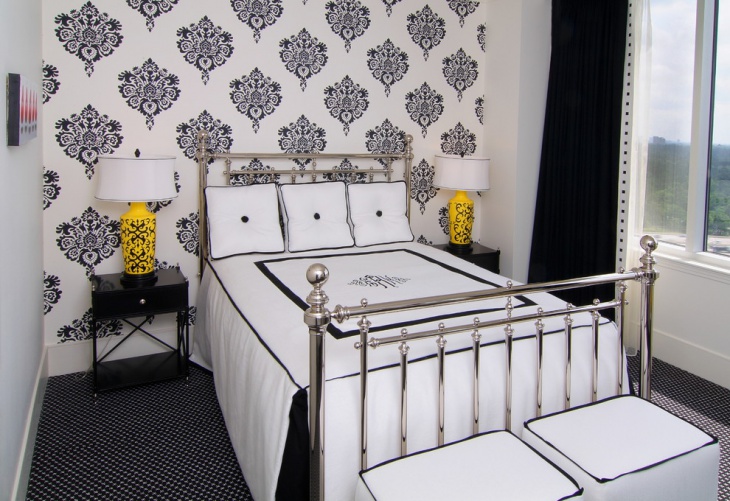black and white bedroom with metal bed