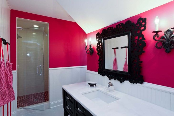 pink bathroom with black designed mirror