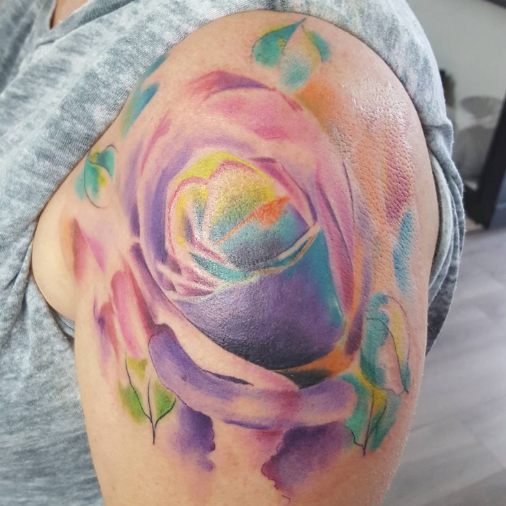 colorful rose tattoo on shoulder