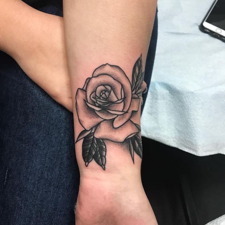 rose tattoo design on wrist