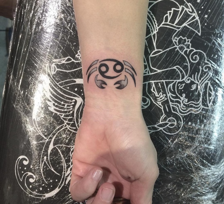 cancer zodaic wrist tattoo design