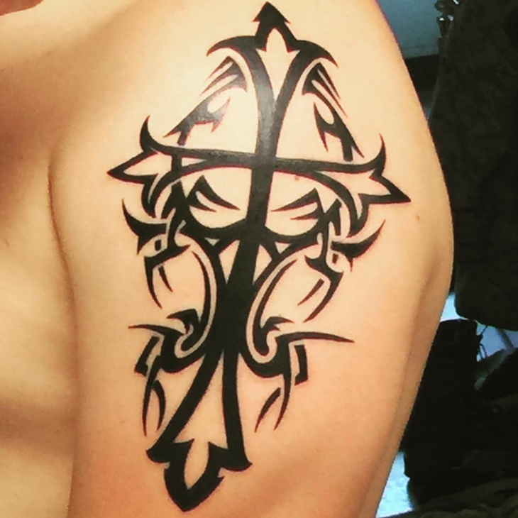 cross tattoo on left hand