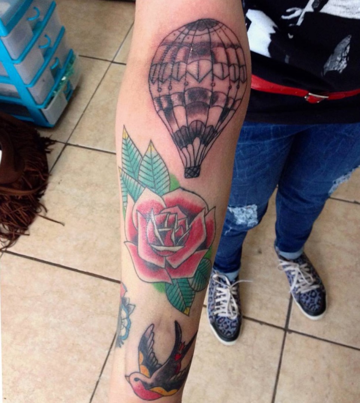 balloon and rose sleeve tattoo