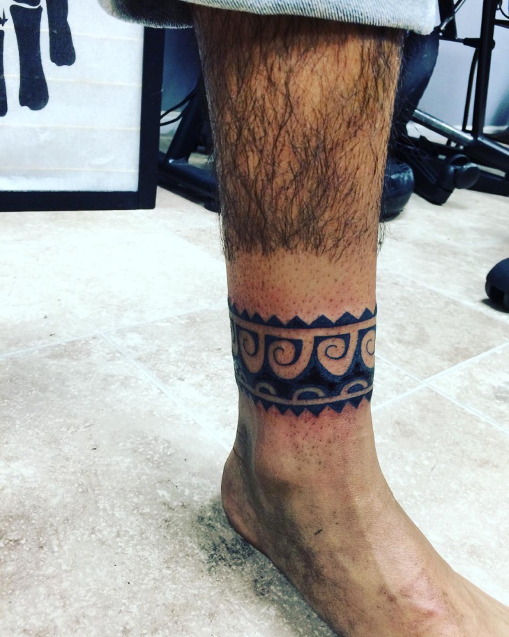 tribal band tattoo on leg
