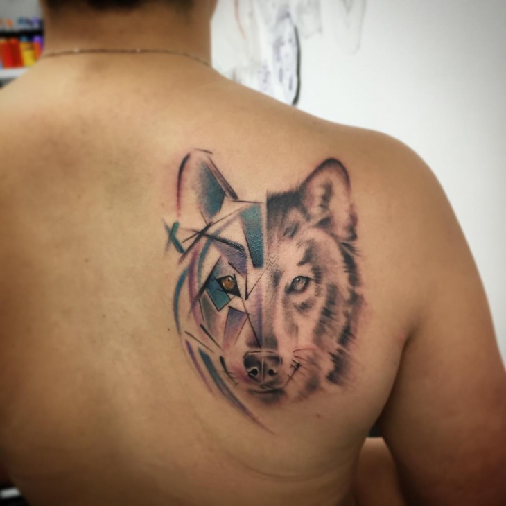 shade wolf tribal tattoo on back side of body1