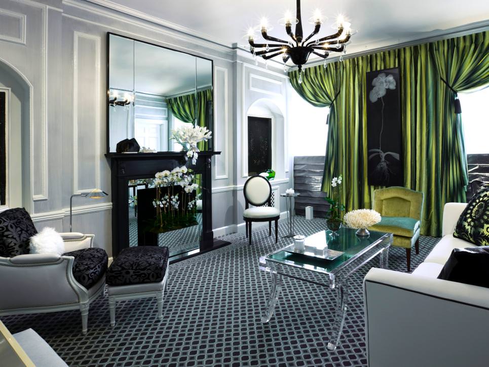 transitional living room with green satin drapes