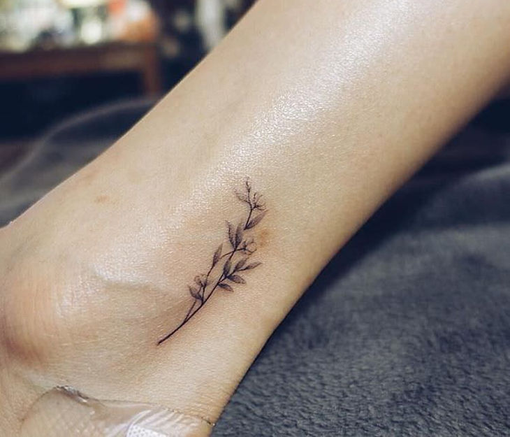 little flower on ankle tattoo design