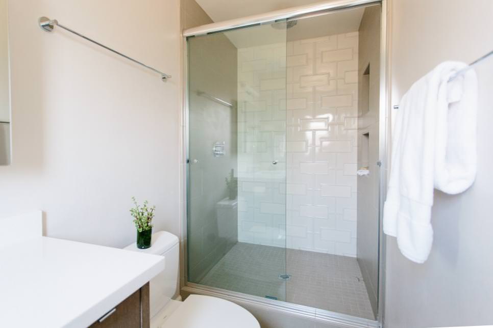 shower stall with modern white tile pattern splash