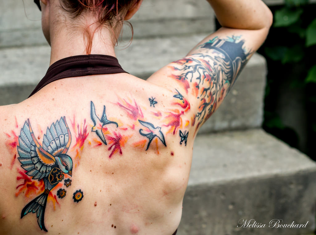 colorful bird design steampunk tattoo