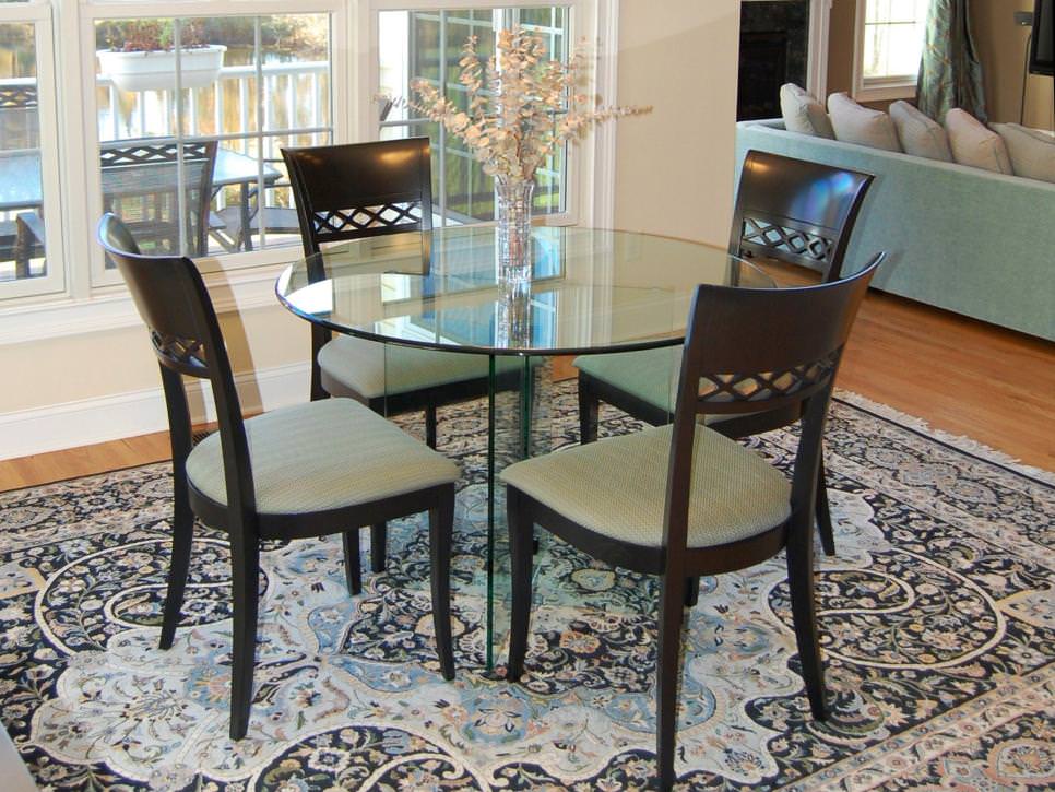 transitional dining room with heirloom rug
