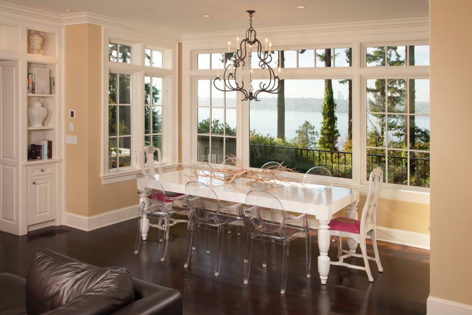 french country dining room with table and glass chairs