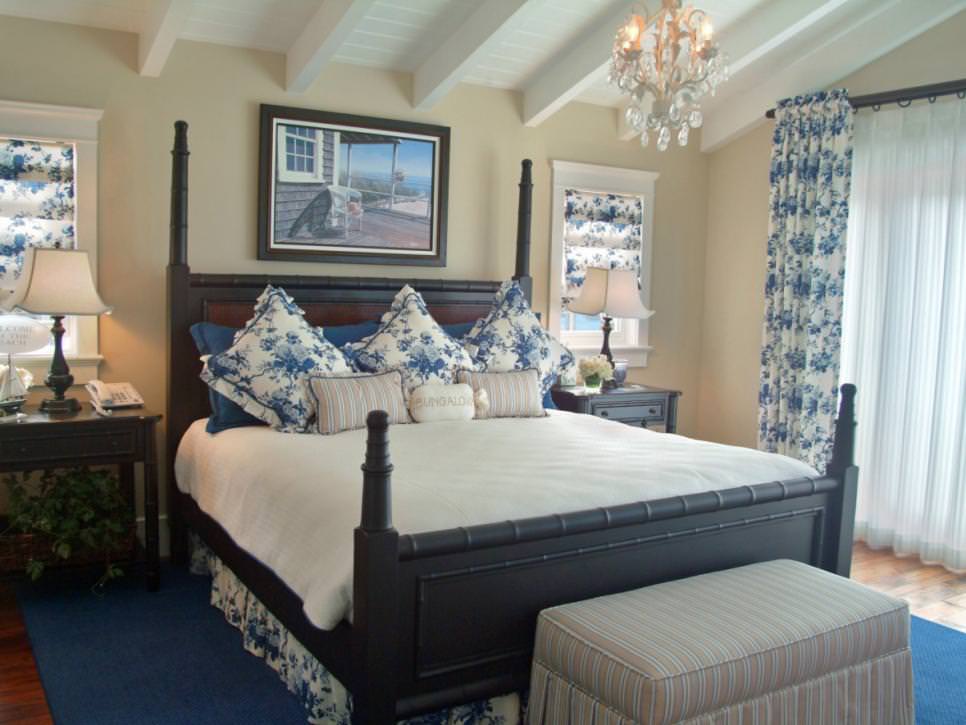 blue floral coastal bedroom with chandelier