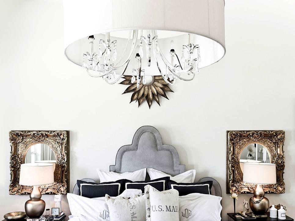white bedroom with crystal chandelier