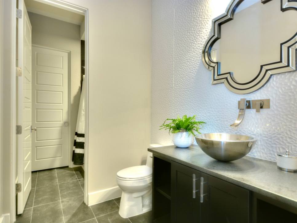 bathroom with textured white accent wall