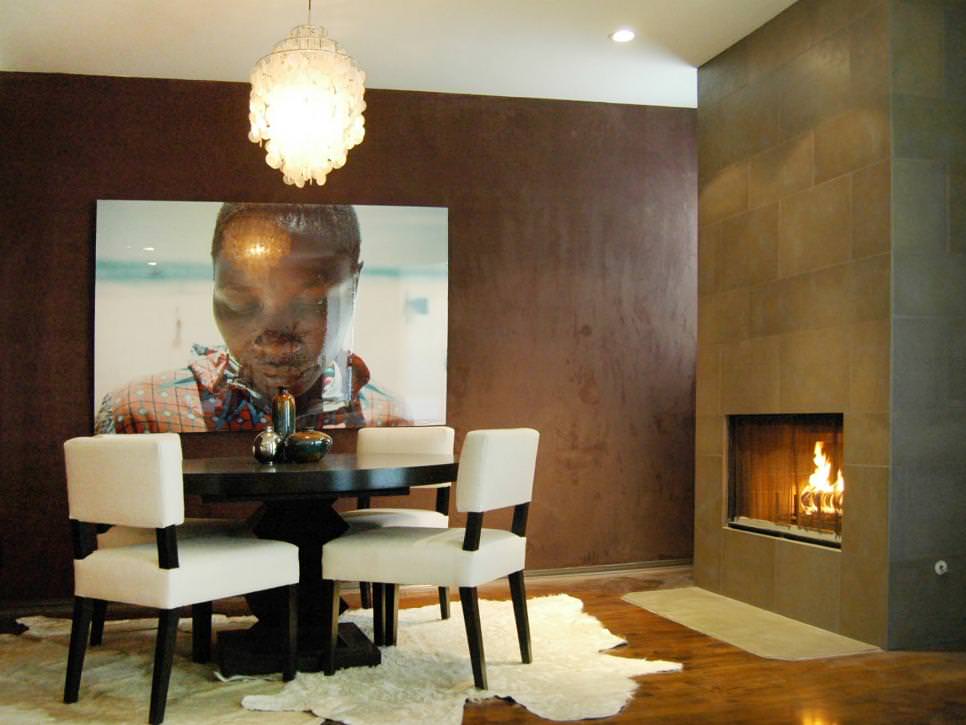 dining space with brown suede wall art