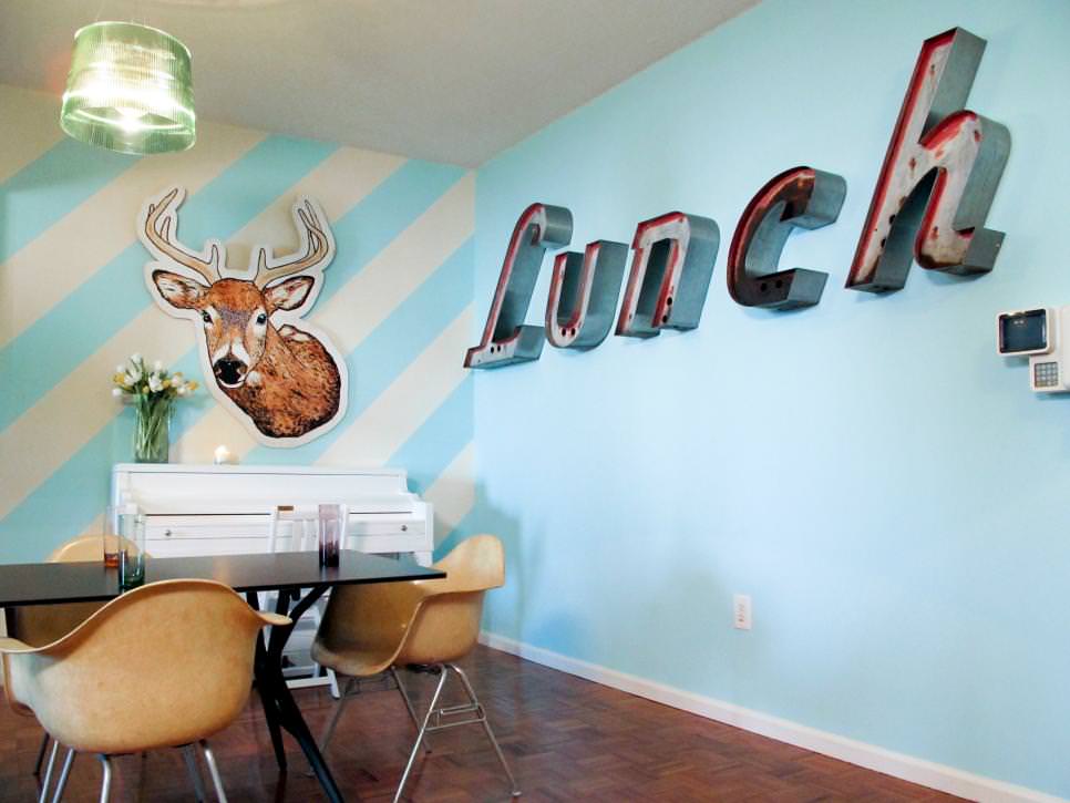 eclectic dining room with wall letters