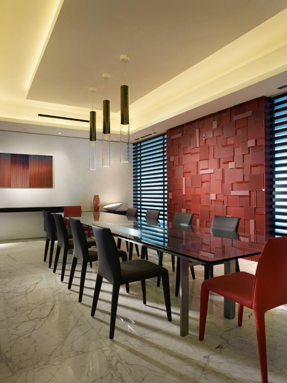 modern dining area with red glass feature wall