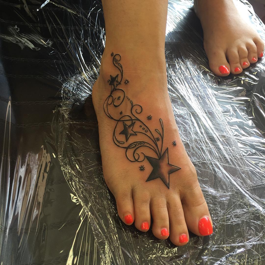 star swirls tattoo on foot