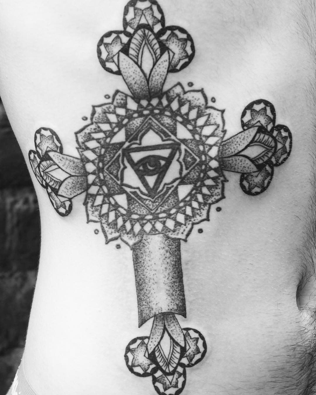 eye inside cross tattoo 